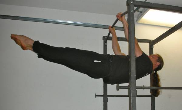 Leg assisted front lever pull-ups on parallel bars - Exercise