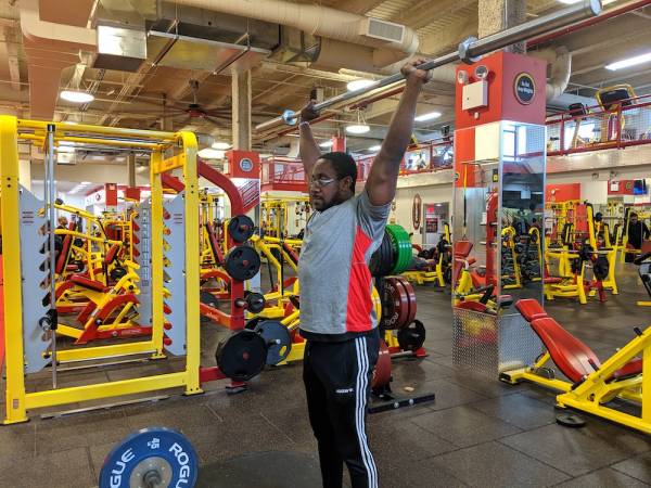 Overhead press position with internal shoulder rotation.