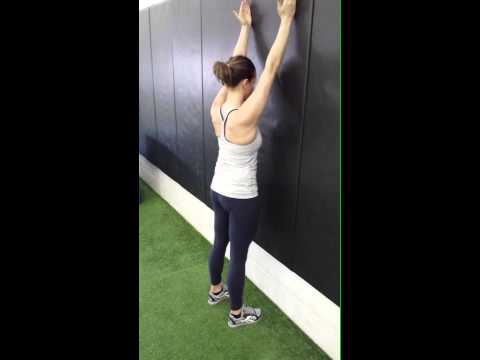 Wall slides for scapular stability 