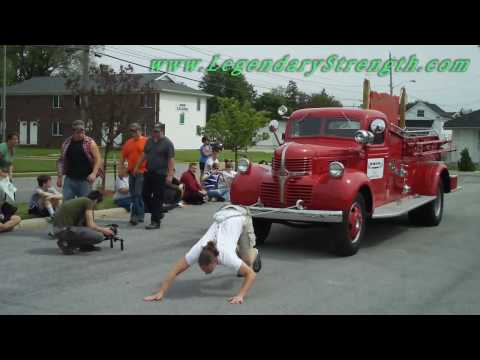 Strongman Picnic Pulling Fire Engine By Hair