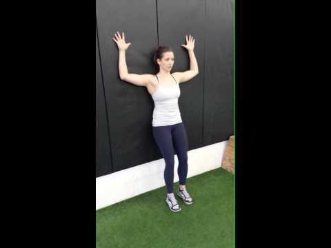 Wall slides for scapular stability