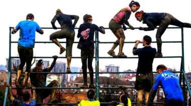 shutterstock245578957|People climb a wall during a Spartan Race.|Vision wild run climbing tower.|Running up a wall during a Judgement Day race.