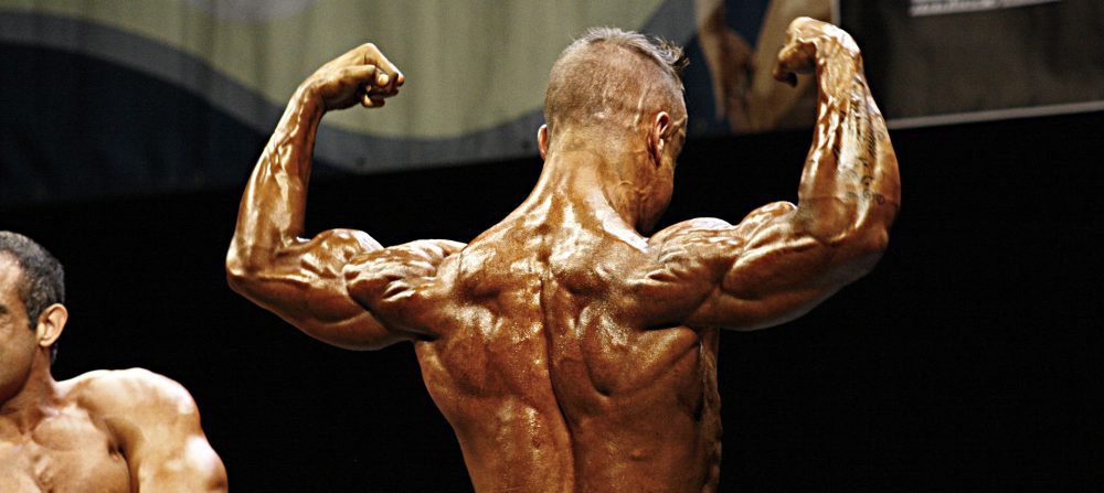 Bodybuilder back pose - AST Sports Science