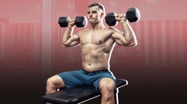 Man performing seated overhead dumbbell press