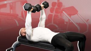 Muscular man in gym lying on bench perform chest exercise with dumbbells