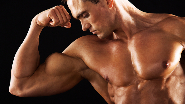 Bodybuilder flexing arm muscle