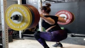 Olympic weightlifter Katherine Nye completing a 410-pound squat PR in April 2022