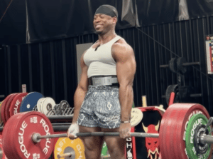 Russell Orhii smiles while PR deadlifting 760 pounds.