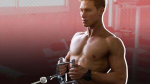 Muscular man performing seated cable row exercise