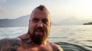 Eddie Hall in front of a body of water in Spring 2022