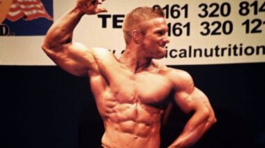Flex Lewis flexing his right bicep while smiling