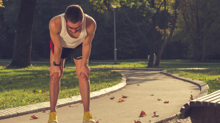 Runners stop and rest outdoors