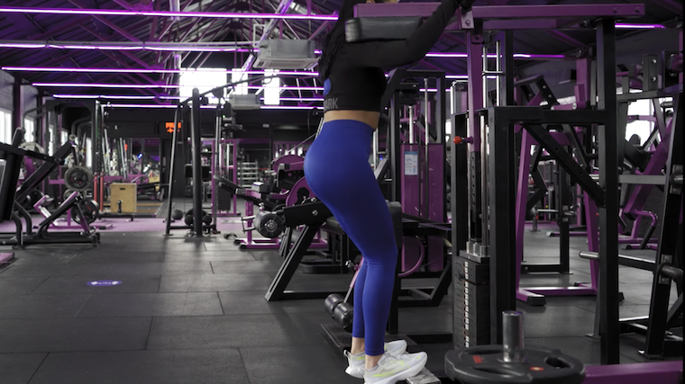 person performing standing calf raise exercise