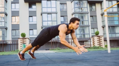 person outdoors performing explosive push-up