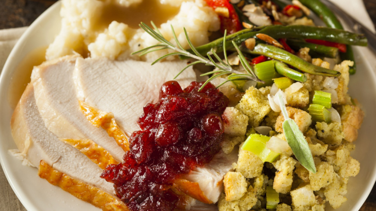 plate of supplies with turkey and stuffing