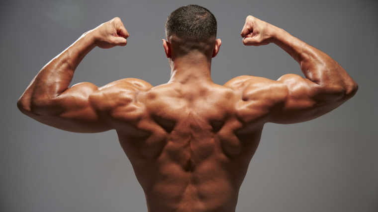 muscular person flexing back and arms