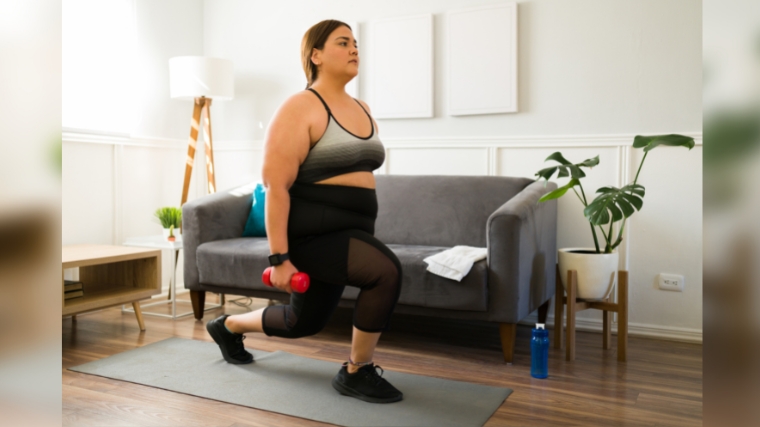 A person exercising and in the split squat position.