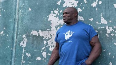Ronnie Coleman standing outdoors with reflective look in 2022