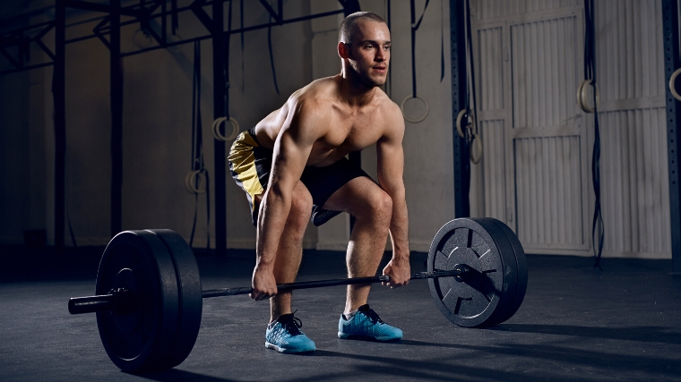 A person starting to do a clean & jerk.