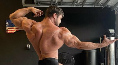 Logan Franklin posing bodybuilding arms