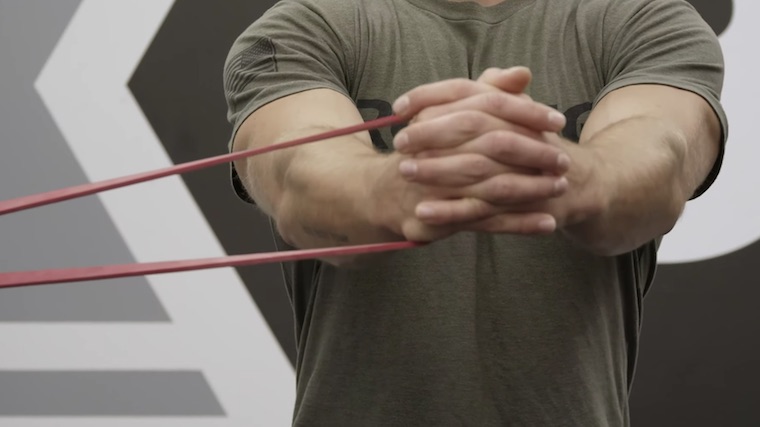 Close view of person in gym holding resistance band