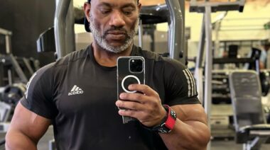 Bodybuilder Dexter Jackson posing in mirror