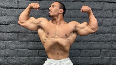 Bodybuilder Larry Wheels in double biceps pose