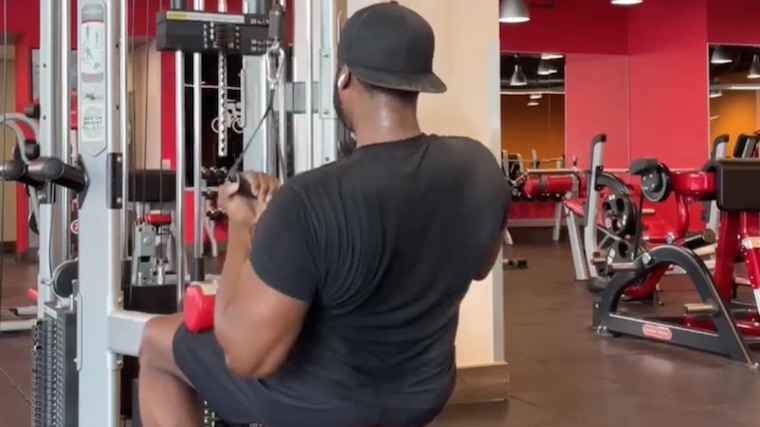 Coach Lee Boyce in gym doing back exercise