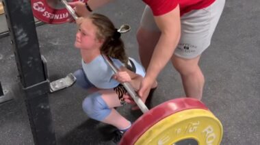 10-year old Rory van Ulft squatting with barbell