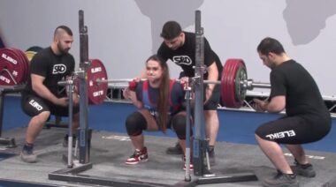 Powerlifter Amanda Lawrence performing squat in competition