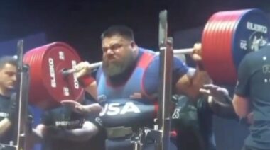 Powerlifting Jesus Olivares performing heavy barbell squat in competition