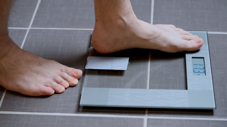Person stepping on scale