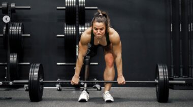 CrossFit athlete Amy Bream in gym performing deadlift