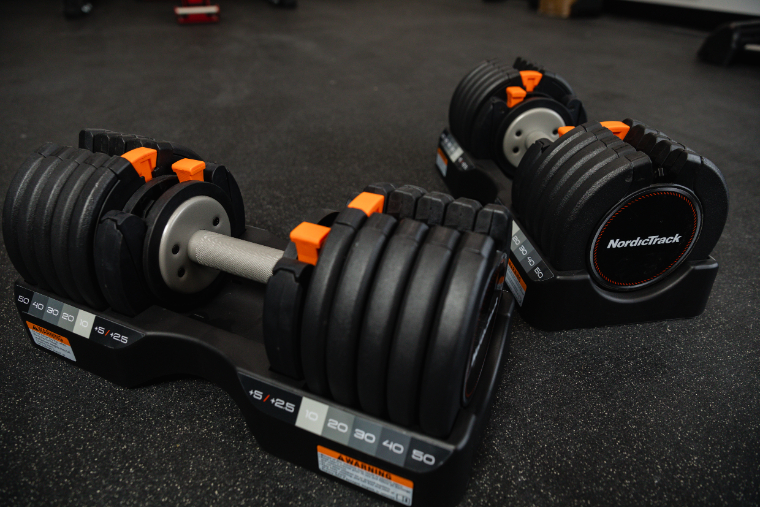 The NordicTrack Select-a-Weight dumbbells in their storage tray