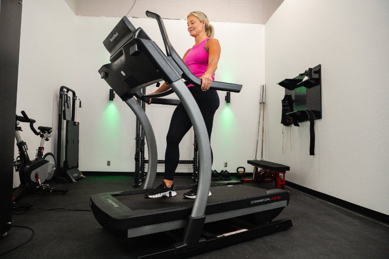 An athlete walks on a NordicTrack X22i treadmill