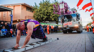Australian strongman competitor Jordan Steffens pulls a truck.