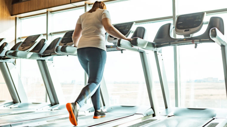 Person in gym on treadmill