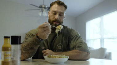 Chris Bumstead eating a meal.