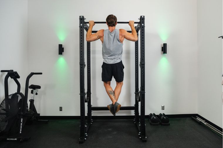 A young man doing pull-ups on the Titan X-3 Power Rack