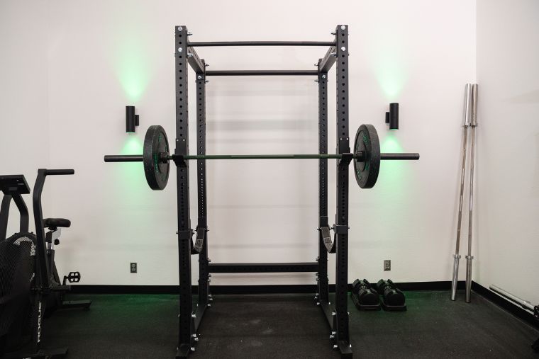 The Titan X-3 Power Rack with a loaded barbell on it