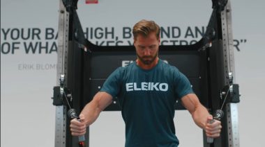 Eleiko Sport employee testing out the new cable pulley system.