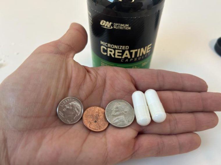 Comparing Optimum Nutrition Creatine capsules to the size of different US coins.