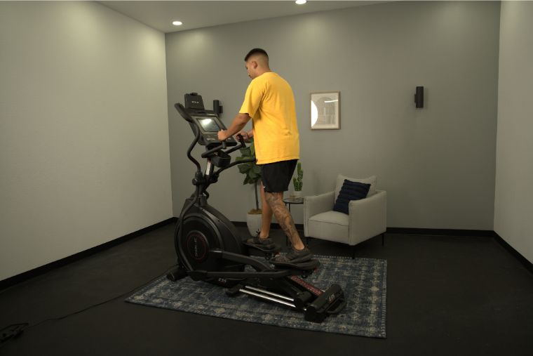 A man working out on the Sole E35 elliptical machine